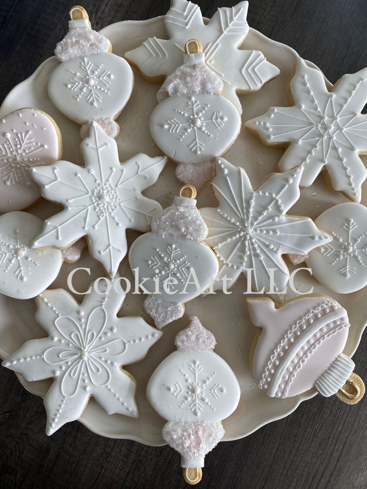 Elegant Winter-Themed Decorative Cookies Shaped Like Snowflakes and Ornaments.