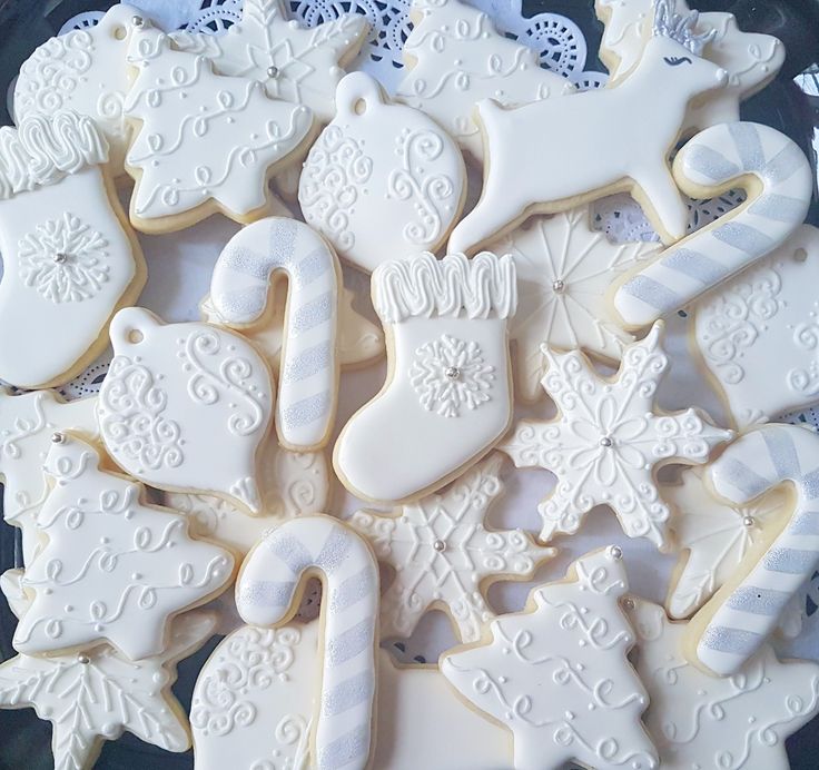 Whimsical Christmas Cookies with Delicate Icing Designs for Winter Celebrations.