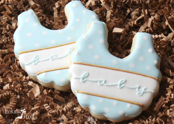 Charming Baby-Themed Cookies: Soft Blue Onesies with Elegant Polka Dots for Celebrations.