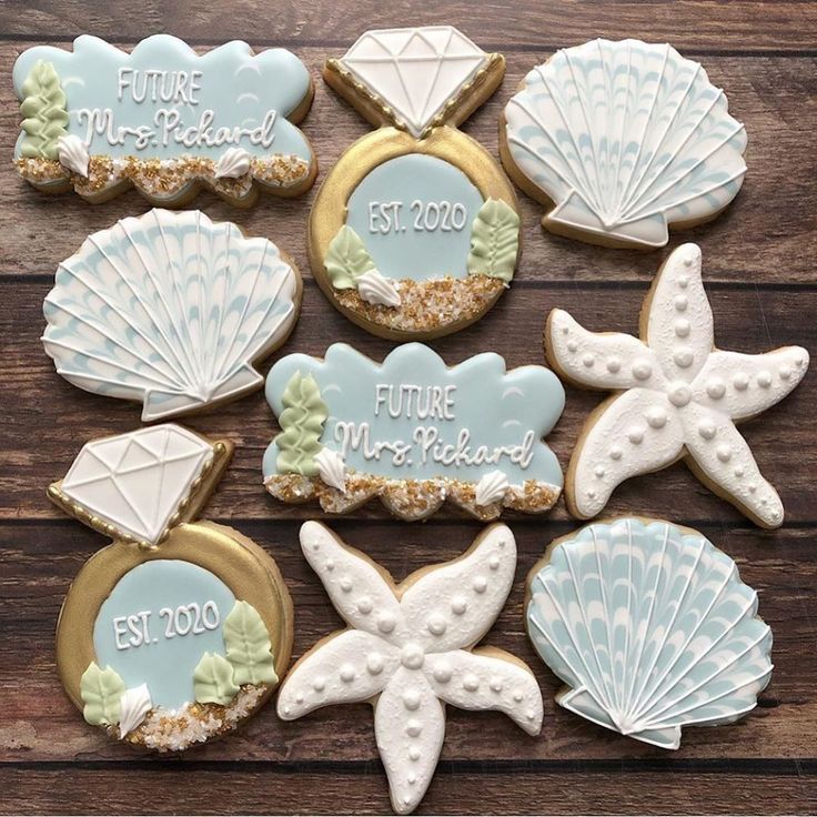 Whimsical Beach-Themed Decorative Cookies Featuring Seashells, Starfish, and Elegant Textures.