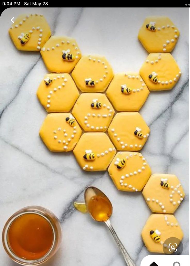 Whimsical Honeybee-Inspired Cookies Arranged in a Vibrant Honeycomb Display