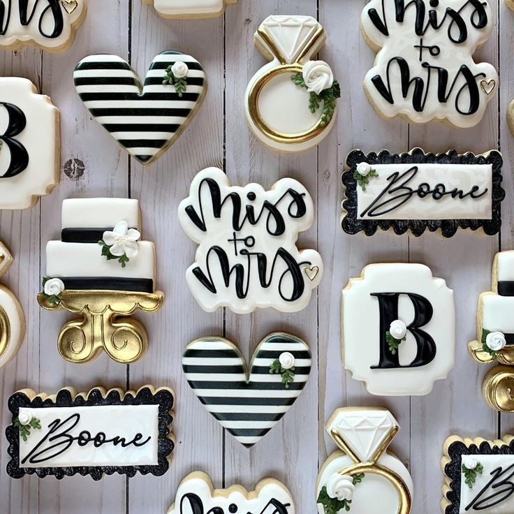 Elegant Decorative Cookies with Sophisticated Black and White Stripes and Floral Accents.