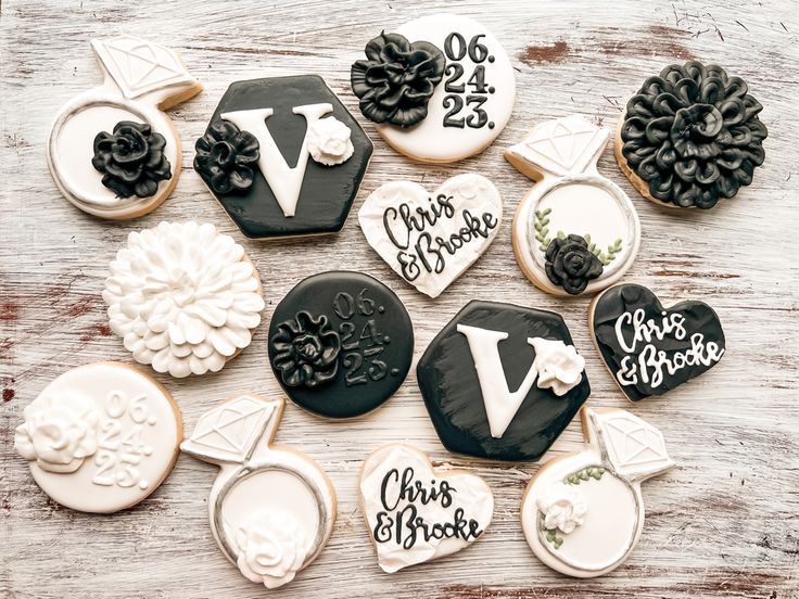 Elegant Decorative Wedding Cookies with Intricate Floral and Diamond Ring Designs.