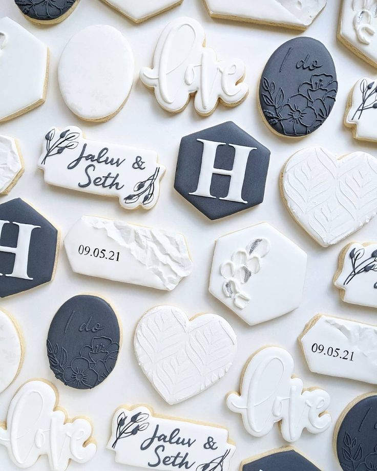 Elegant Mixed-Shaped Cookies with Romantic Icing Designs for Special Occasions.