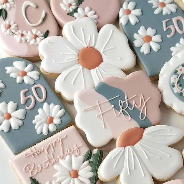 Charming Pastel Cookie Designs with Floral Motifs for Milestone Celebrations