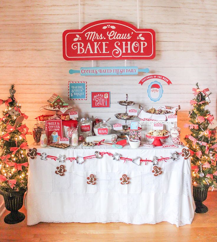 Whimsical Holiday Dessert Table with Festive Decor and Delectable Treats