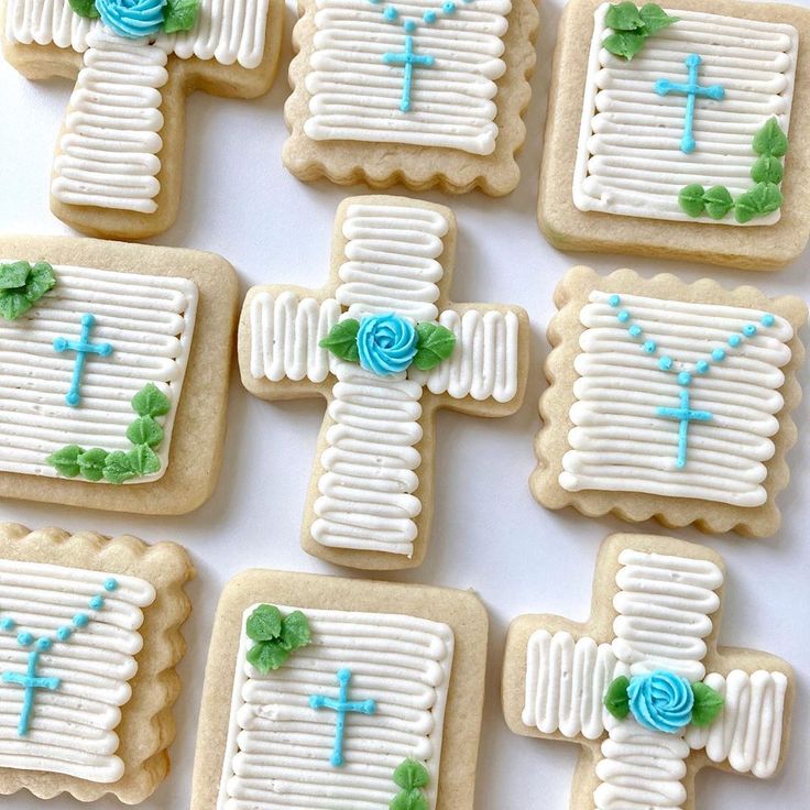 Intricately Iced Decorative Cookies with Floral Accents in Soft Blue and Green Hues.