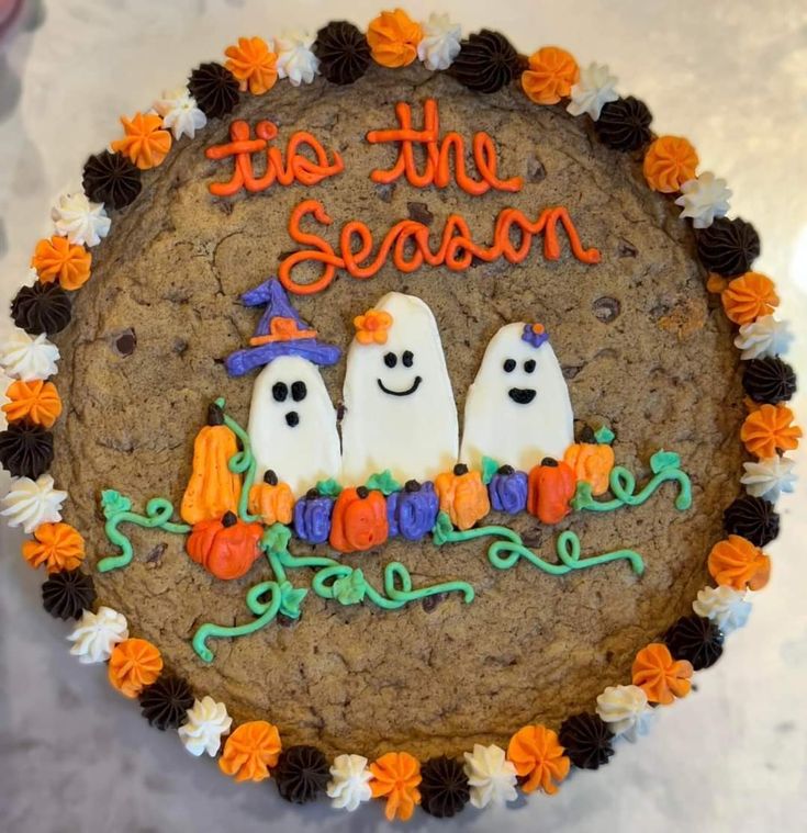 Festive Halloween Cookie Cake Adorned with Ghosts and Pumpkins