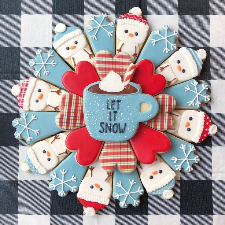 Cheerful Festive Cookie Display with Snowmen, Winter Designs, and Cozy Cup Accents.