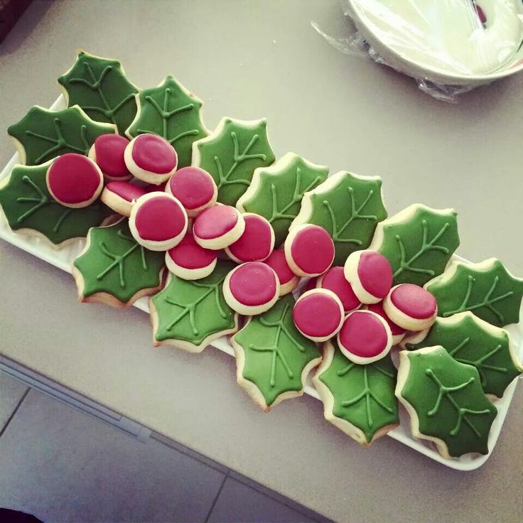 Cheerfully Festive Holiday Cookies Decorated as Holly Leaves and Berries.