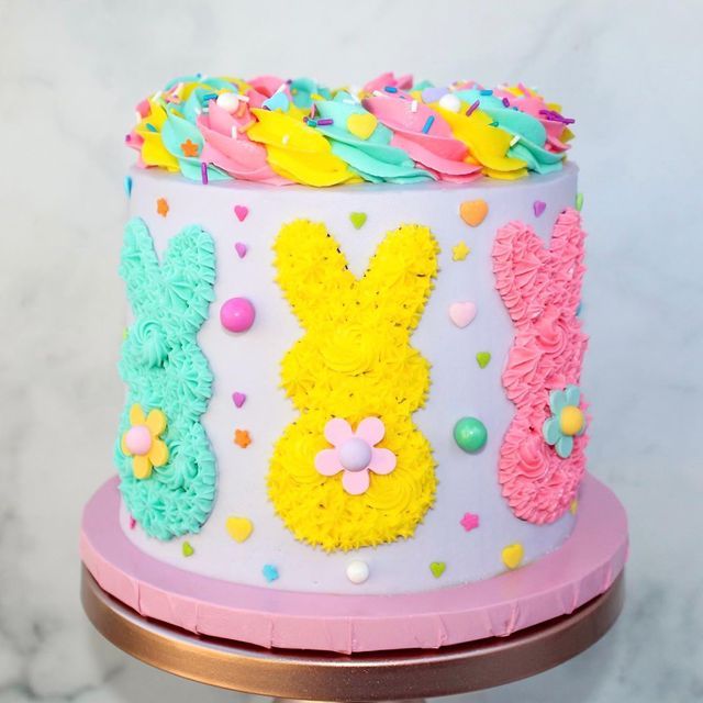 Playful Pastel Cake Design with Whimsical Bunny Decor and Festive Accents.