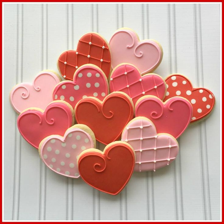 Charming Layered Heart-Shaped Cookies in Vibrant Colors for Romantic Celebrations.