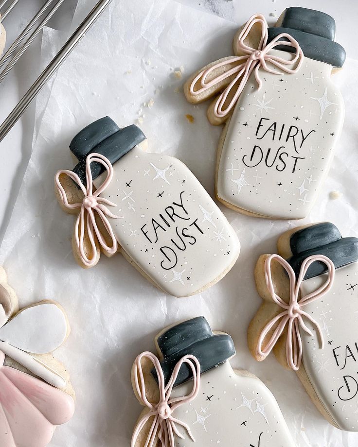 Whimsical Cookie Design with Pastel Jars, Bows, and Starry Patterns for Magical Celebrations.