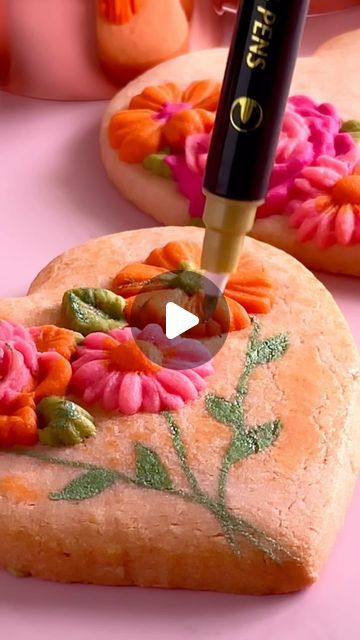 Vibrantly Decorated Heart-Shaped Cookies with Floral Designs