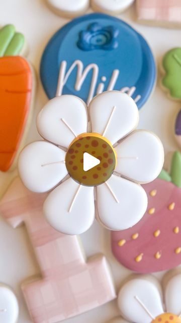 Whimsical Colorful Cookie Designs: Cheerful Flowers, Playful Strawberries, and Vibrant Carrots for Festive Celebrations.