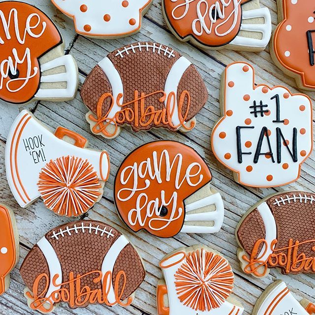 Festive Football-themed Cookies Enhance Game Day Spirit with Whistles and Pom-Poms.