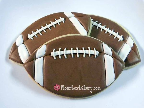 Playful Football-Shaped Cookies: Festive Treats Perfect for Game Day Celebrations.