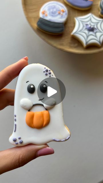 Charming Ghost-Shaped Cookie with Playful Design, Perfect for Halloween Treats.