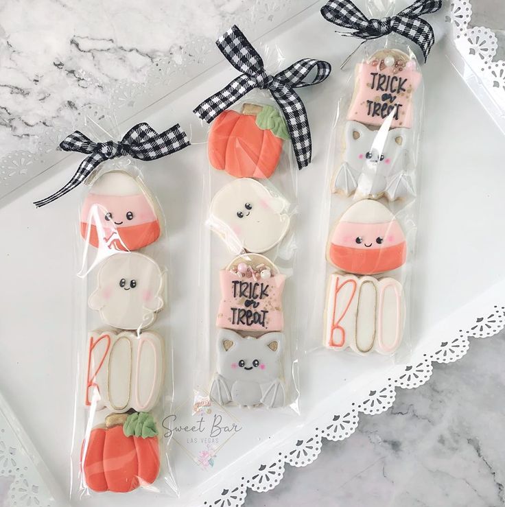 Whimsical Halloween-Themed Decorative Cookies with Cheerful Designs and Festive Packaging