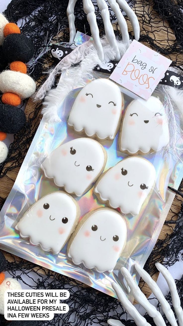 Playful Ghost-Shaped Cookies Perfectly Enhance a Whimsical Halloween Theme.