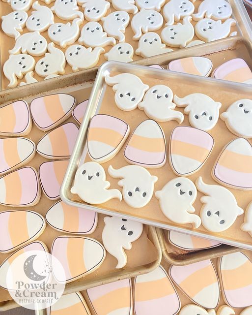 Whimsical Ghost-Shaped Cookies with Pastel Candy Corn: A Festive Delight.