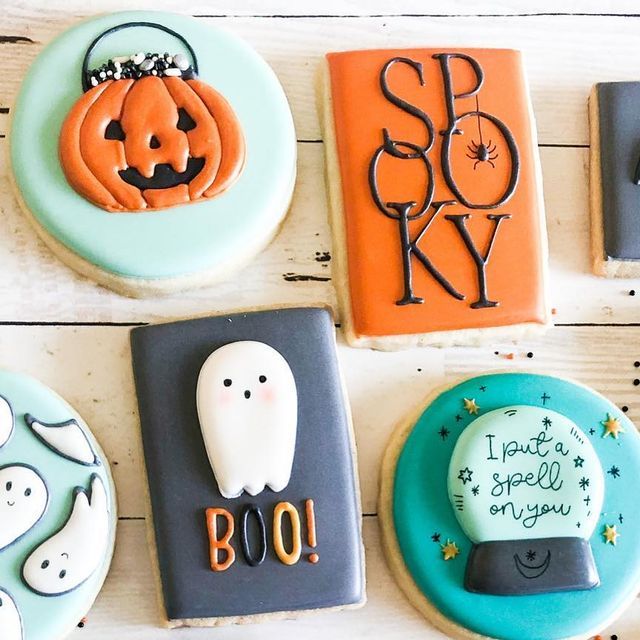 Festive Halloween Cookies with Intricate Ghost and Pumpkin Designs