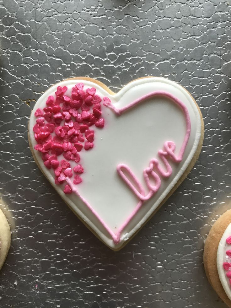 Romantic Heart-Shaped Cookie with Pink Icing and Sprinkles