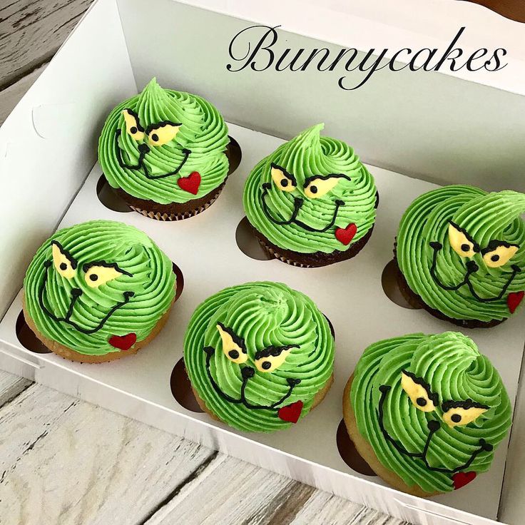 Whimsical Colorful Cupcakes with Grinning Character Frosting and Fondant Accents.