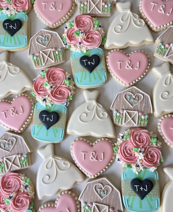 Whimsical Wedding-Themed Decorative Cookies with Elegant Pastel Designs.