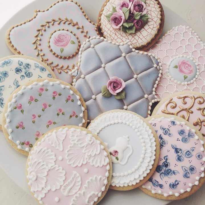 Elegant Display of Intricately Iced Decorative Cookies in Pastel Palette.