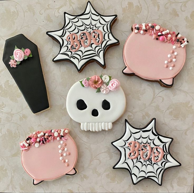 Halloween-Themed Decorative Sugar Cookies: Intricate Designs in Unique Shapes and Colorful Aesthetics.