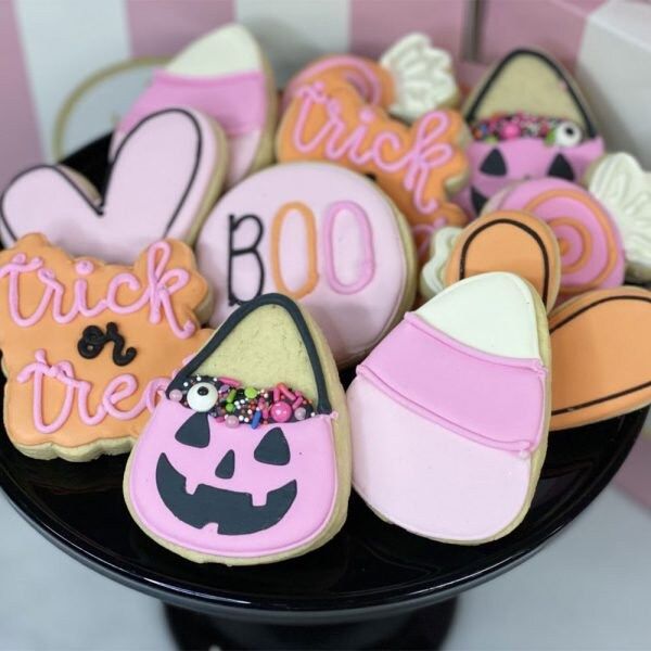 Vibrant Halloween Cookies Delightfully Displayed on a Black Platter