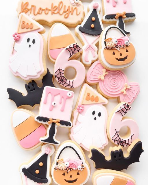 Whimsical Festive Halloween Cookies: Vibrant Designs for Seasonal Celebrations.