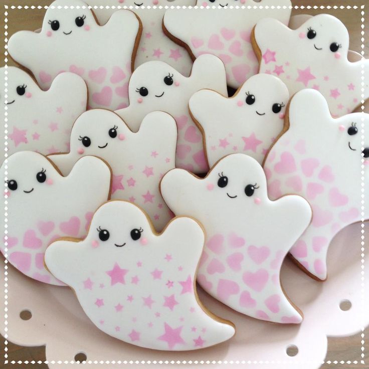 Whimsical Ghost-Shaped Cookies: Sweet Pastel Treats for Playful Halloween Aesthetics.