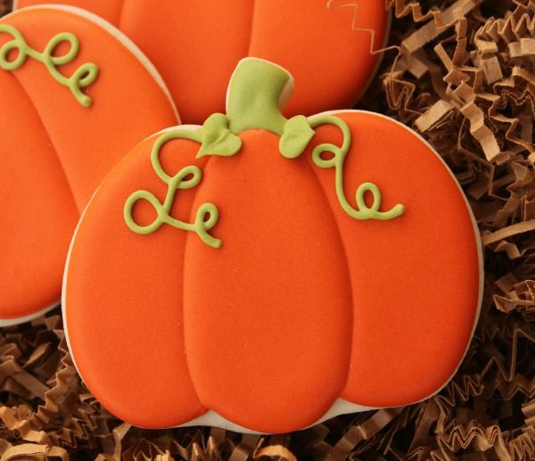 Vibrant Pumpkin-Inspired Nail Design with Glossy Finish and Playful Green Accents