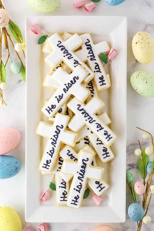 Festive Easter Cookies Decorated with Cross Shapes and Surrounded by Pastel Accents.