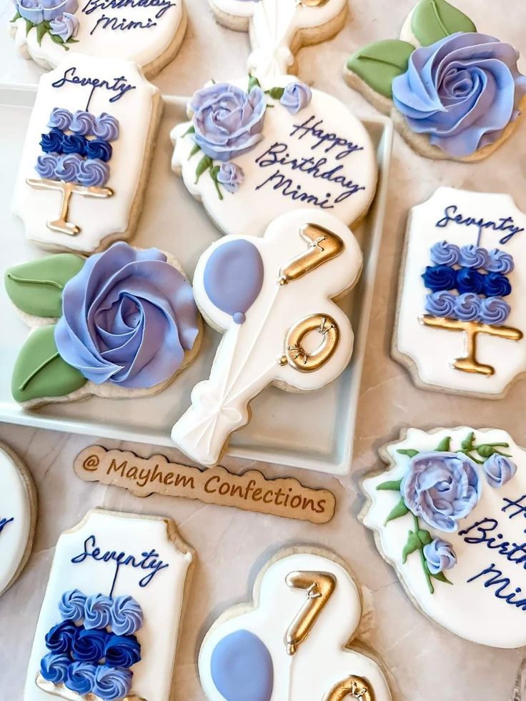 Intricate Floral and Birthday-Themed Decorative Cookies in Soft Pastel Hues.