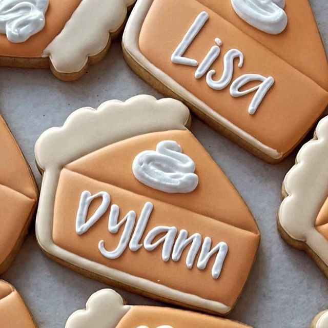 Charming Decorative Pie Slice Cookies with Soft Pastel Colors and Personalized Designs for Celebrations.