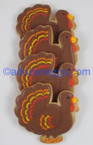 Vibrant Thanksgiving Turkey Cookies Adorned with Intricate Icing Designs.