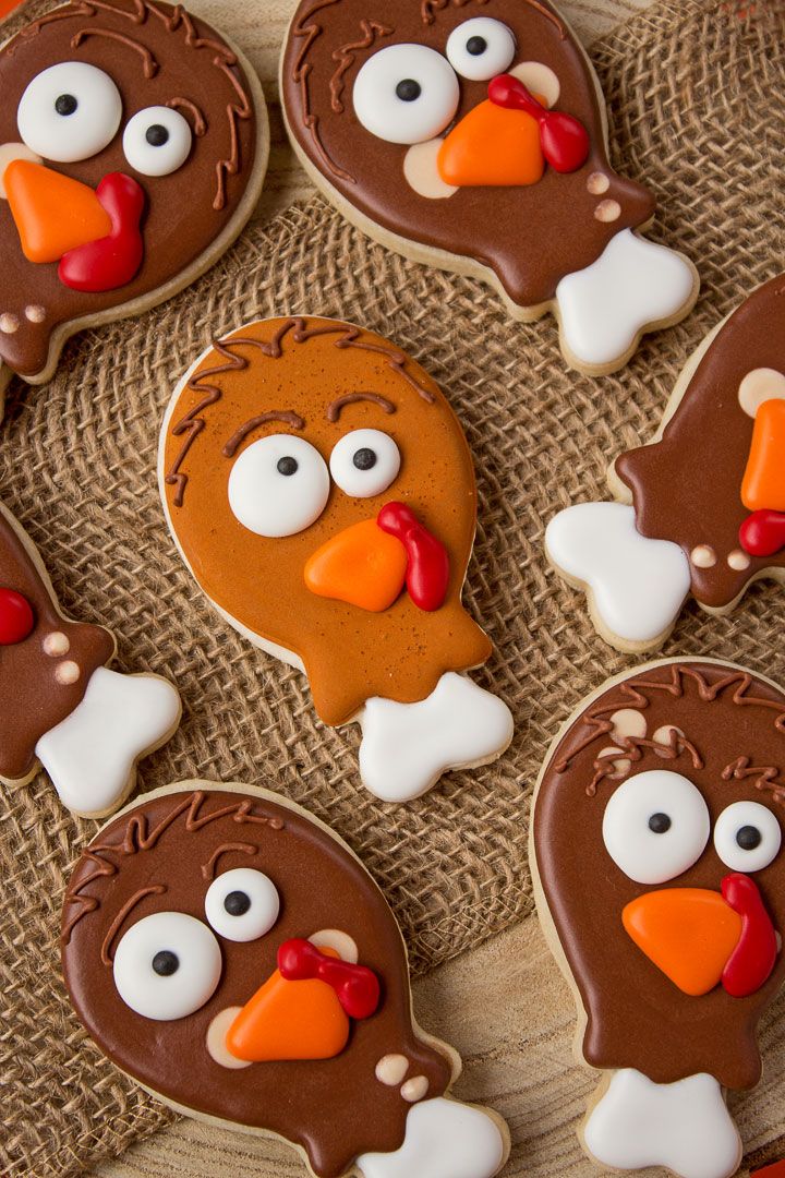 Whimsical Turkey-Shaped Cookies Bring Festive Cheer with Bright Icing and Expressive Designs.