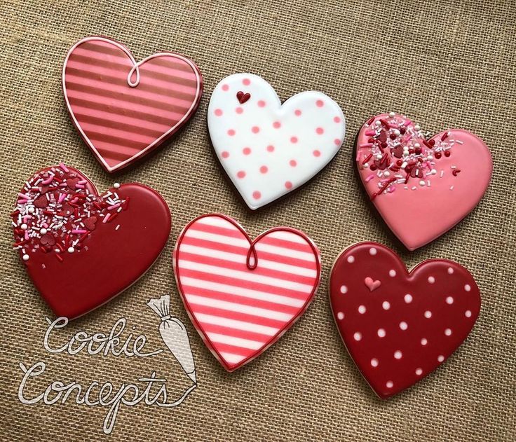 Playful Heart-Shaped Cookies with Unique Designs in Festive Colors.