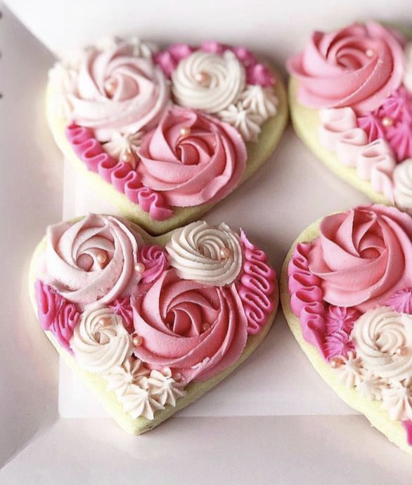 Elegant Heart-Shaped Cookies with Floral Frosting Design