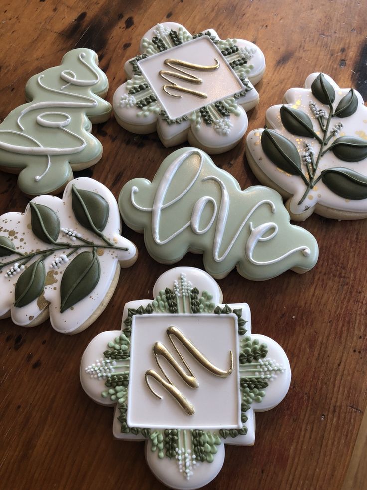 Elegant Green and White Cookies Showcase Intricate Designs for Special Occasions.