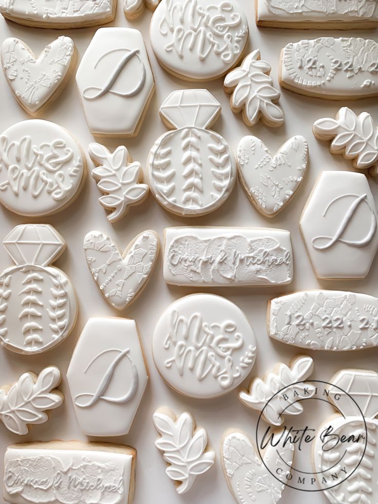 Elegant Wedding Cookies with Intricate Lace and Floral Designs.