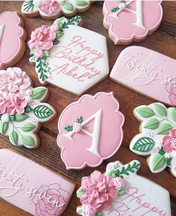 Elegant pastel pink cookie designs embellished with intricate floral decorations for festive celebrations.