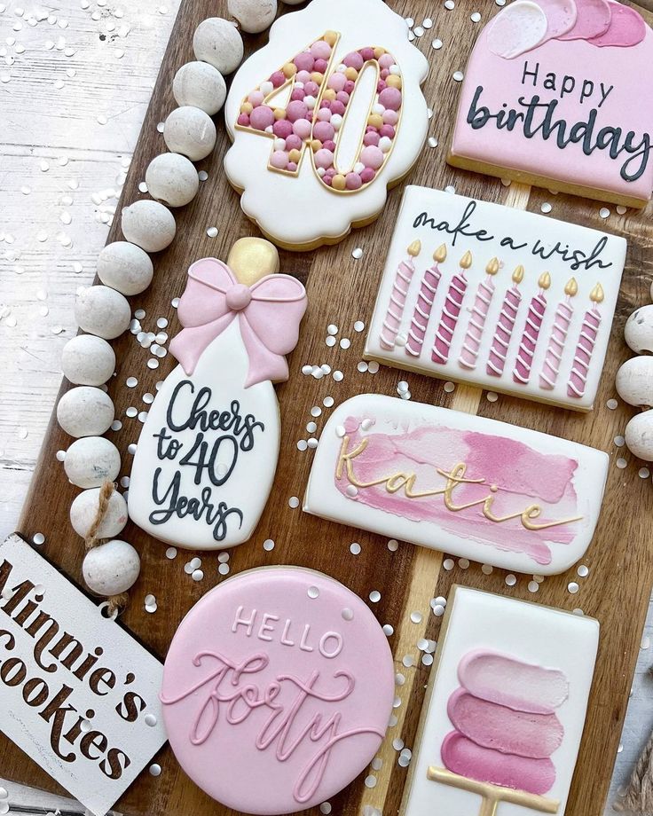 Elegant Pink and White Milestone Birthday Cookies with Festive Designs and Intricate Details