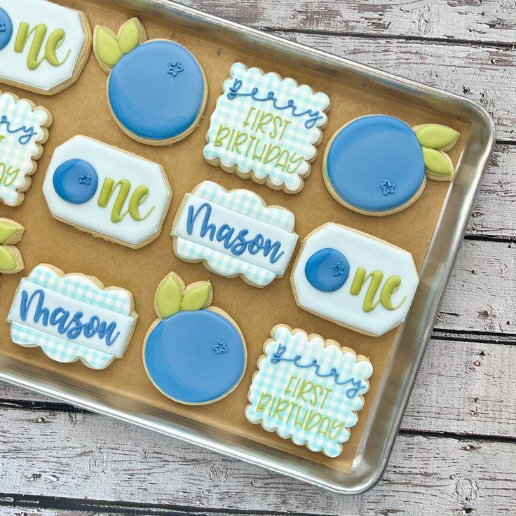 Bright Blue and White Decorative Birthday Cookies with Playful Blueberry Designs.