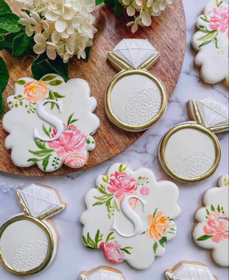 Sophisticated Floral-Inspired Wedding Cookies with Pastel Colors and Gold Accents.