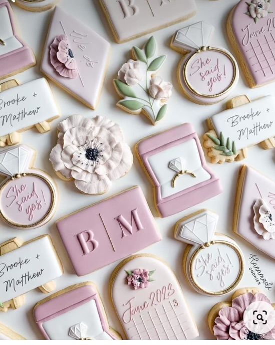 Elegant Pastel Decorative Cookies with Floral and Wedding Motifs for Celebrations.