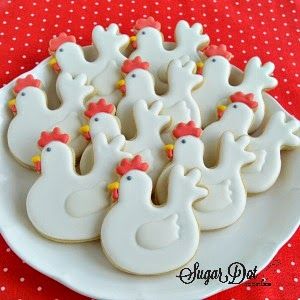 Festive Chicken-Shaped Cookies with Icing and Adornments.